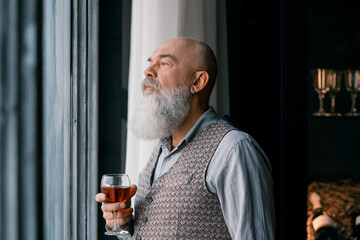 Wall Mural - close-up. portrait of a handsome man with a glass of red wine .