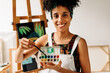 © (JLco) Julia Amaral - Confident young painter holding a palette