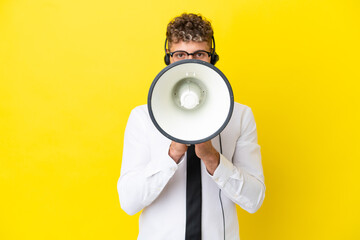 Poster - Telemarketer blonde man working with a headset isolated on yellow background shouting through a megaphone