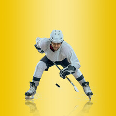 Professional ice hockey player hitting puck for winning goal in action on gradient multicolored neon background. Concept of sport competition.