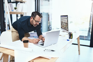 Aufkleber - Ill find what Im looking for online. Shot of a mature male architect working on his laptop.