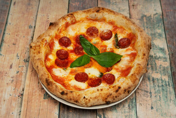 Wall Mural - Pizza Diavola base made with a mixture of organic flour, wholemeal flour, germ, mother yeast, salt, ...spicy ingredients, which should literally make your mouth burn