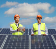 © Ljupco Smokovski - Male engineers on a roof with photovoltaic solar panels
