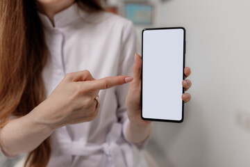 Girl holding mobile phone in hands