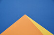 Pyramid on a blue background. Minimalism, abstraction. Flat table