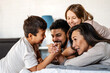 © NDABCREATIVITY - Portrait of happy multiethnic family having fun together at home.