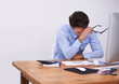 © Marius V/peopleimages.com - So tired.... Cropped shot of a tired-looking young businessman sitting in his office.