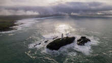 Cornish Lighthouse Island Surrounded By Choppy Seas