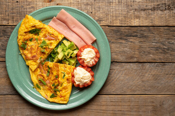 Wall Mural - Ham omelette with avocado and tomato