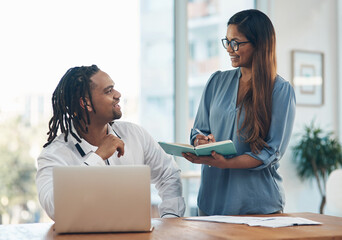 Aufkleber - Noting their big new plans. Shot of two businesspeople having a discussion in an office.