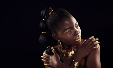 Wall Mural - Can black get more beautiful. Studio shot of a beautiful young woman wearing make up and jewellery against a black background.