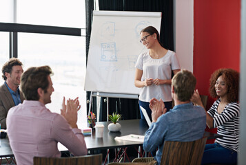 Poster - Another presentation done to perfection. Shot of a woman giving a presentation to a group of colleagues in a boardroom.