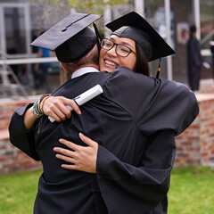 Poster - Lifes great moments. Shot of two students hugging on graduation day.