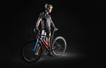 Spost background with copyspace. Cyclist. Dramatic colorful close-up portrait.