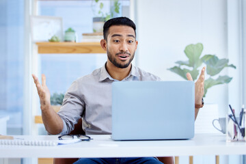 Aufkleber - This is the best surprise ever. Shot of a young businessman looking surprised while working on a laptop in an office.