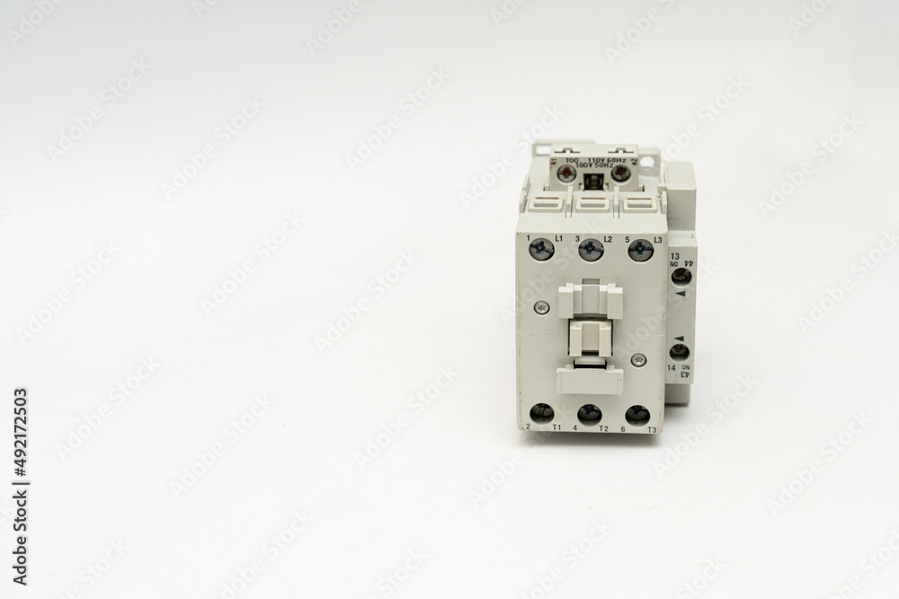 Magnetic contactor with Overload Relay isolate on white background. The magnetic contactors used to control the distribution of power in lighting and heating circuits.