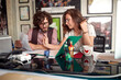 © luckybusiness - male and female caucasian colleagues working together at the office, looking at papers, analyzing data.