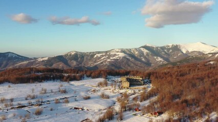 Wall Mural - Aerial view at the mountain on a sunny winter day