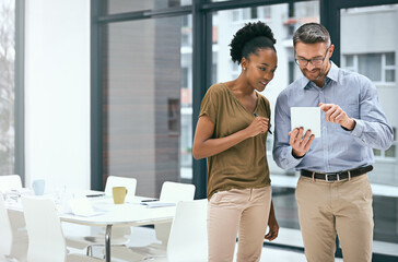 Aufkleber - Growing their business through technology. Cropped shot of two colleagues working together on a digital tablet in an office.