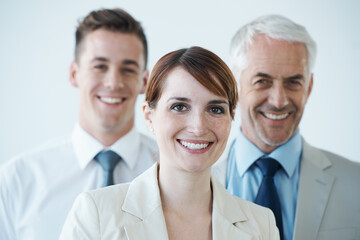 Poster - Well get it done. Shot of a three corporate coworkers in an office.