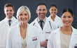 © Alexandra/peopleimages.com - Medicines finest. Studio portrait of a team of doctors standing against a grey background.