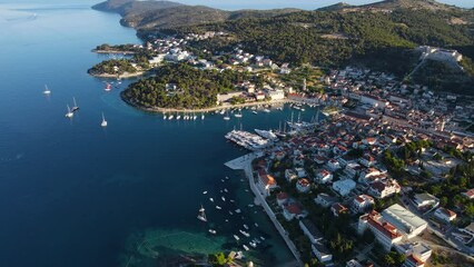 Wall Mural - Aerial view of the old town of Hvar with harbor on Adriatic sea, Croatia, Europe. Drone 4k video. Summer vacation destination