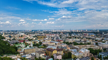 Wall Mural - Kyiv cityscape aerial drone view, Dnipro river, downtown and Podol historical district skyline from above, city of Kiev and Dnieper, Ukraine