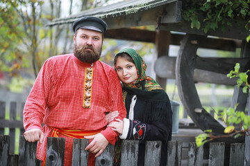 Wall Mural - Traditional Slavic rituals in the rustic style. Outdoor in summer. Slavic village farm. Peasants in elegant robes.