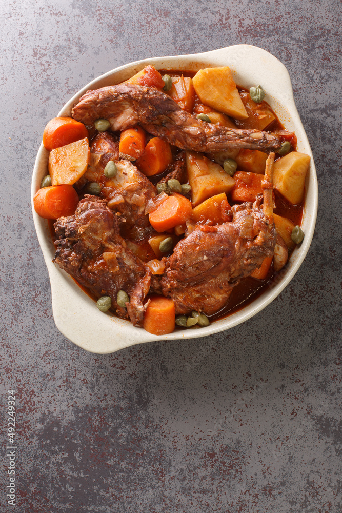 Traditional Malta national dish stewed rabbit Stuffat tal-Fenek closeup ...