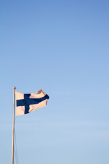 flag of finland against a blue sky