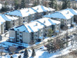 aerial view of apartment in residential area after snow storm