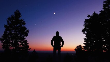 Wall Mural - man observing evening sky with stars, planets and crescent moon.