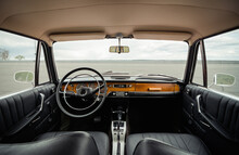 Classic Car Interior With Black Leather And Wood Trim
