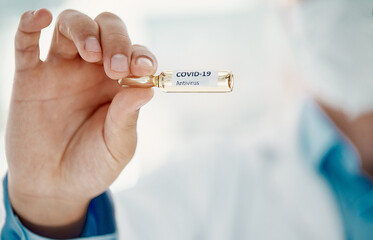 Canvas Print - Coming to a pharmacy near you soon. Cropped shot of a scientist holding an ampoule with 2019-nCov on it.