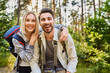 © baranq - Portrait of laughing couple hiking together in the woods