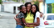 © Marco - Mother and children making heart symbol with hands. African black mom and teen daughters