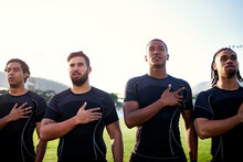 Keeping Up With Traditions. Cropped Shot Of A Diverse Group Of Sportsmen Standing Together And Singing Their National Anthem Before Playing Rugby.