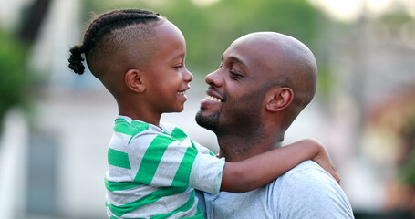 Wall Mural - Father and son doing eskimo kiss. African black dad and child bonding together. Family love and affection