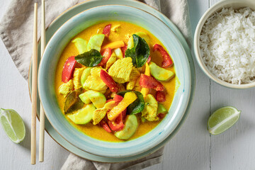 Wall Mural - Yellow curry with kaffir leaves, chicken and coconut milk