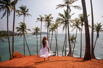 Canvas Print - Woman in a white dress on a paradise island