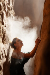 Wall Mural - Beautiful woman resting in the desert