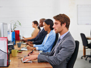 Poster - Theyre always available to help. Cropped shot of a group of coworkers sitting at their desks.