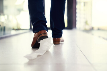 Poster - Dragging his embarrassment along. Closeup shot of a businessman walking in an office with toilet paper stuck to his shoe.