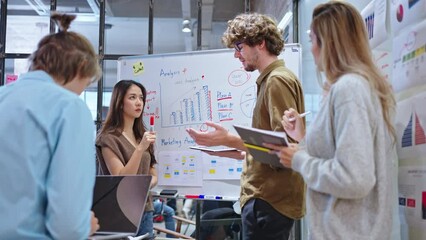 Wall Mural - Group of young creative multiethnic business team brain storm meeting presentation,discussing roadmap to product launch, planning,strategy,new business development,working with new startup project in 