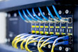 © A Stockphoto - Network switch and ethernet cables,Data Center Concept.