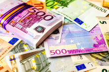 A Pack Of European Currency Lies On The Background Of The Euro