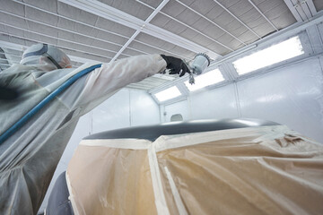 Wall Mural - Close-up photo of car painter work process in workshop