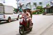 © Tamani C/peopleimages.com - Its a fun way to explore the city. Shot of a young couple enjoying a scooter ride around the city.