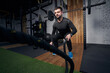 © Viacheslav Yakobchuk - Man using fitness training battle ropes in gym