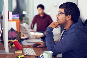 Poster - The IT experts. Shot of employees in an IT office.